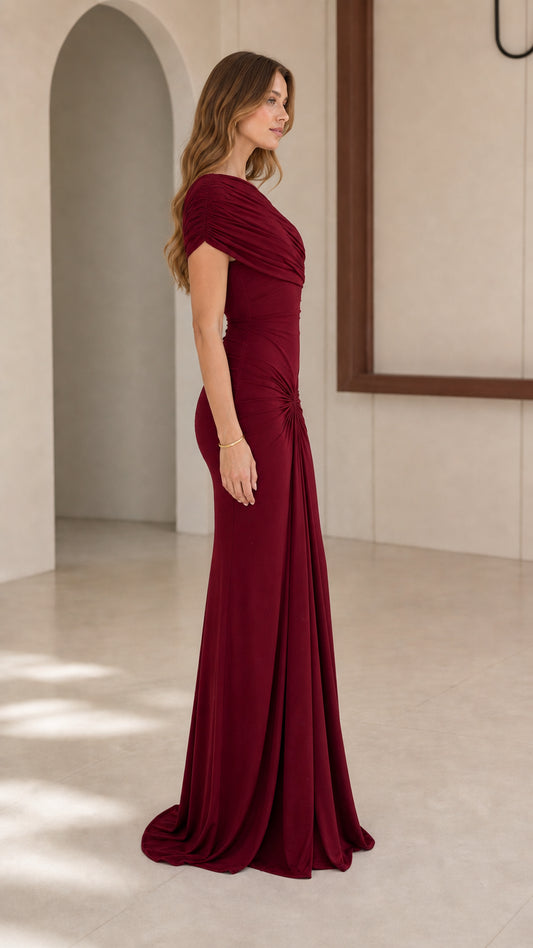 Model wearing Burgundy one-shoulder evening gown, side view