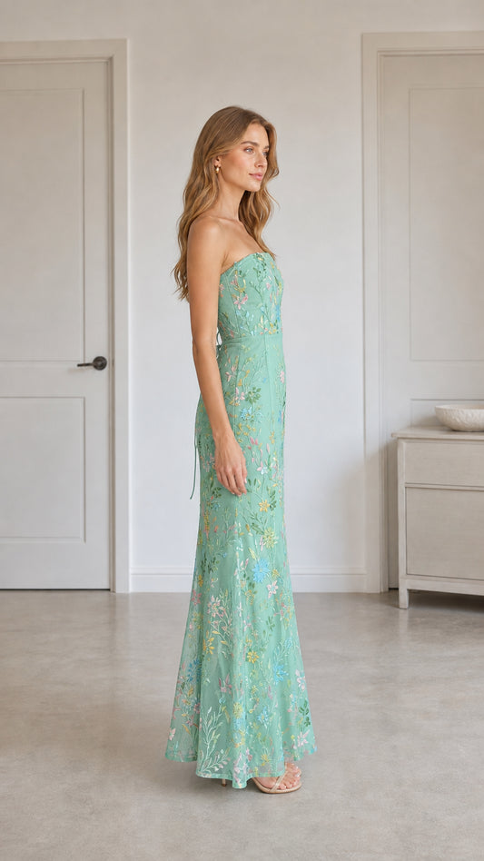 Side profile of mint green strapless dress showing silhouette