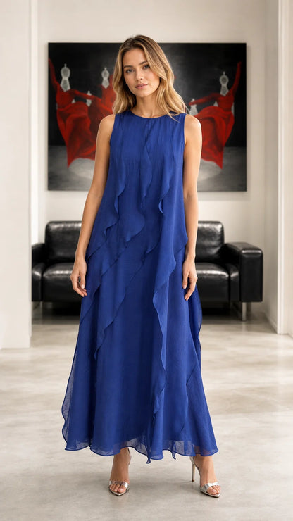 Front view of woman wearing royal blue sleeveless ruffled chiffon maxi dress
