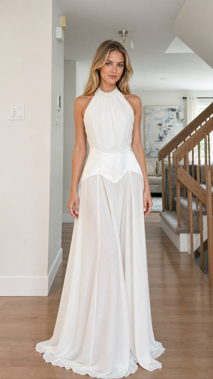 Front view of model wearing white halter open back maxi dress