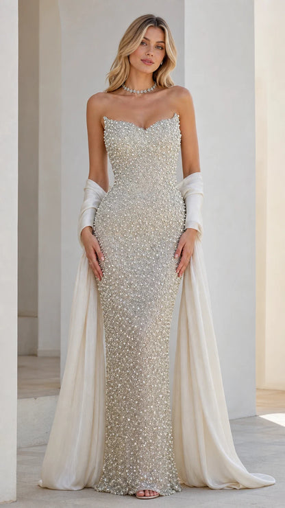 Front view of champagne beaded strapless evening dress with draped wrap