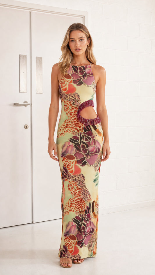 Woman wearing yellow floral print sleeveless cutout maxi dress from the front