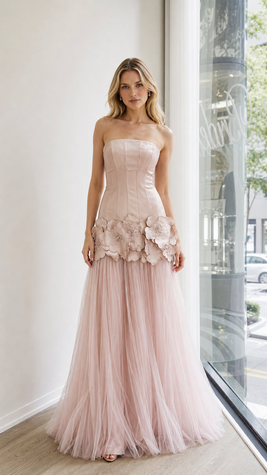 Front view of blush pink strapless tulle evening dress with 3D floral appliques