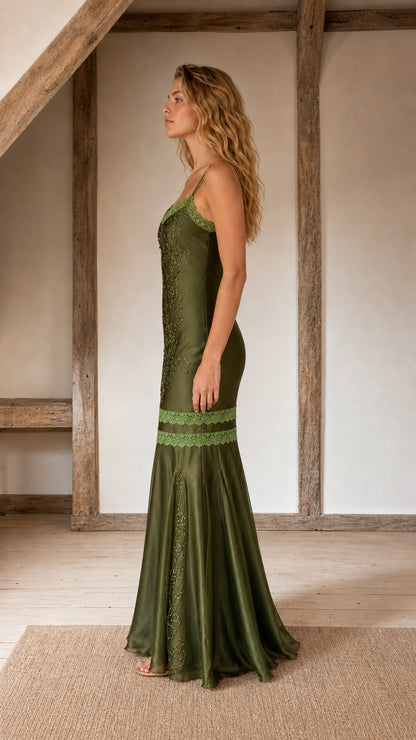 Side profile view of olive satin evening gown
