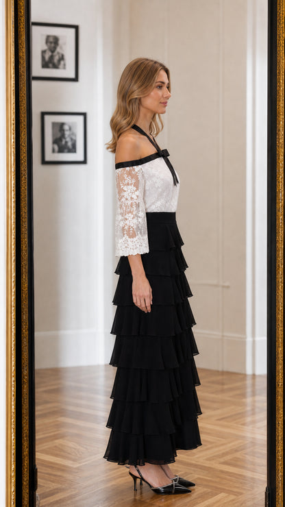 Side profile view of the white and black lace maxi dress