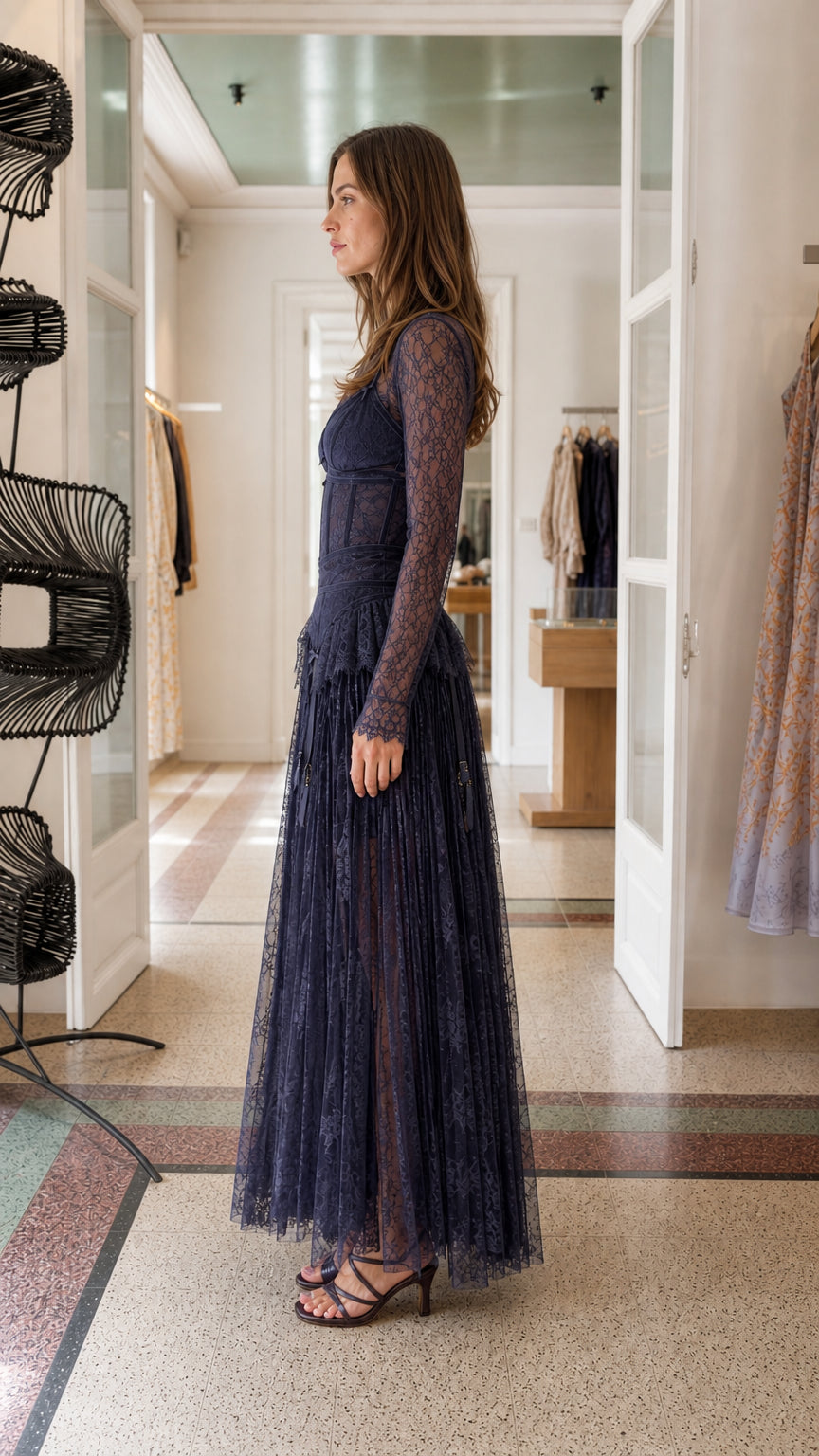 Side view of model in Navy lace maxi dress