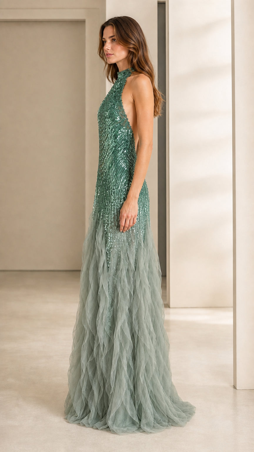 Side profile view of green sequin formal gown
