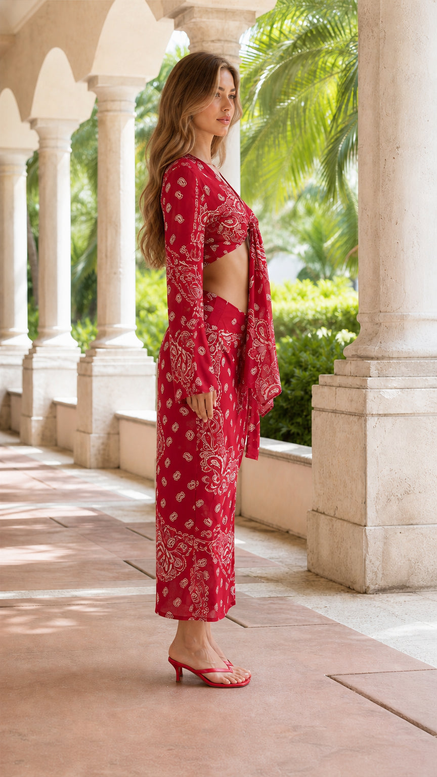 Side profile of woman in red paisley two-piece set
