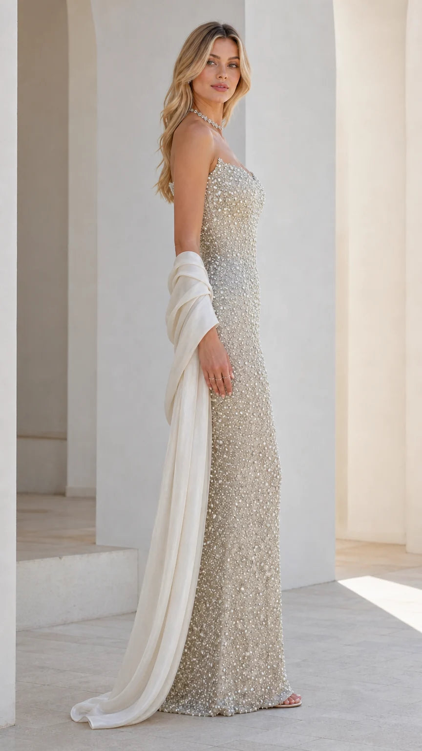 Side profile of champagne beaded evening gown
