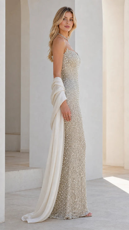 Side profile of champagne beaded evening gown