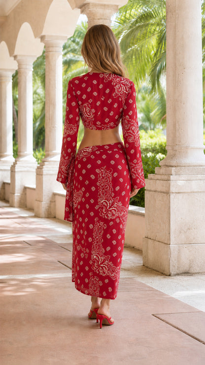 Back view of woman wearing red paisley tie-front top and skirt