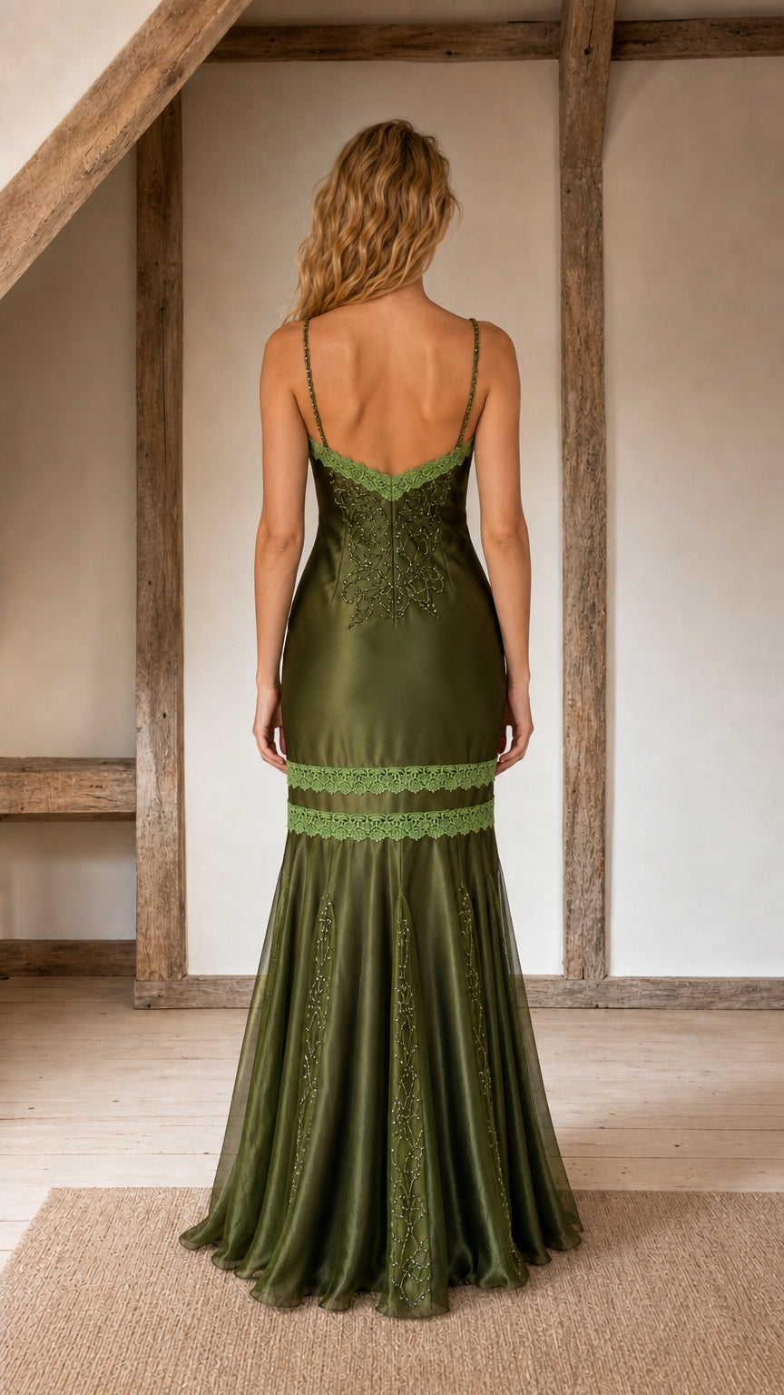 Back view showing strap details and silhouette of olive dress