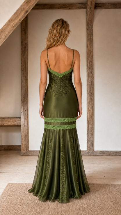 Back view showing strap details and silhouette of olive dress