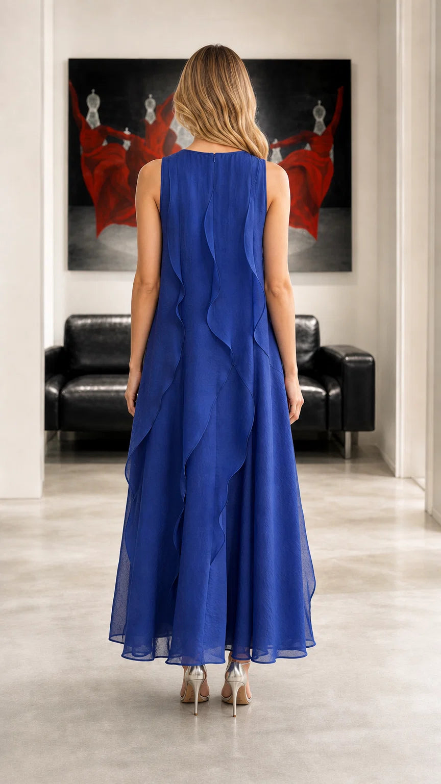 Back view showing cascading ruffles on royal blue maxi dress