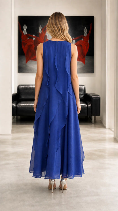 Back view showing cascading ruffles on royal blue maxi dress