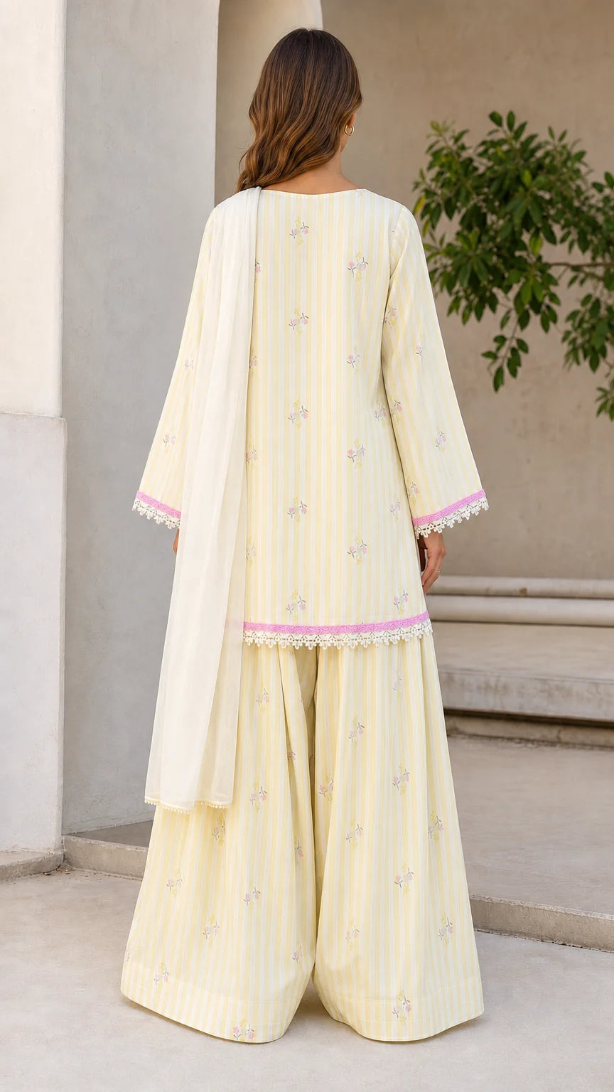 Back view of woman wearing yellow ethnic suit set