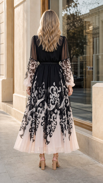 Model wearing black and blush scroll print chiffon maxi dress back view