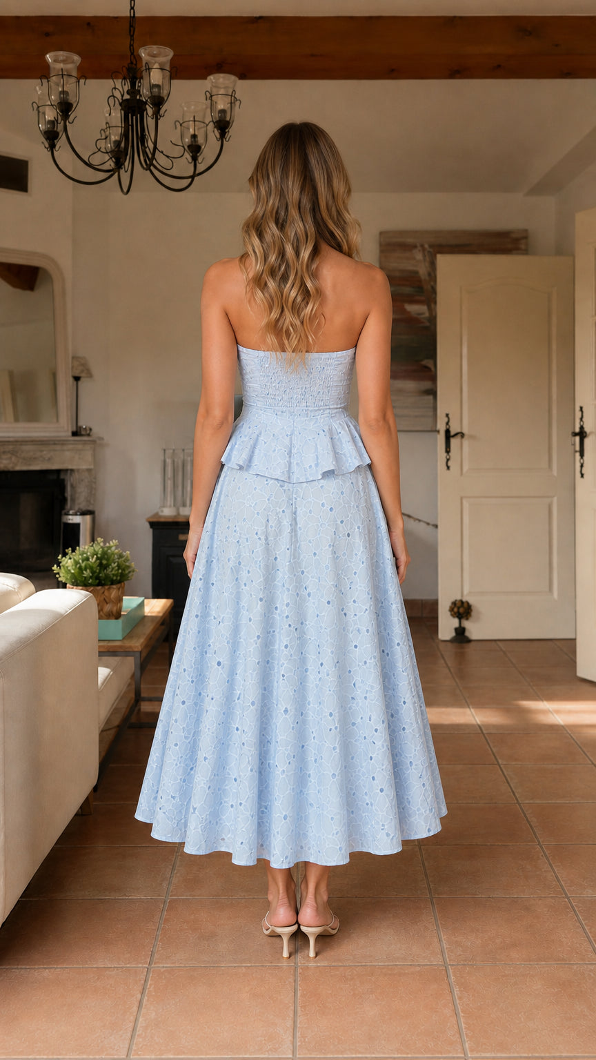 Back view of model wearing light blue eyelet midi dress
