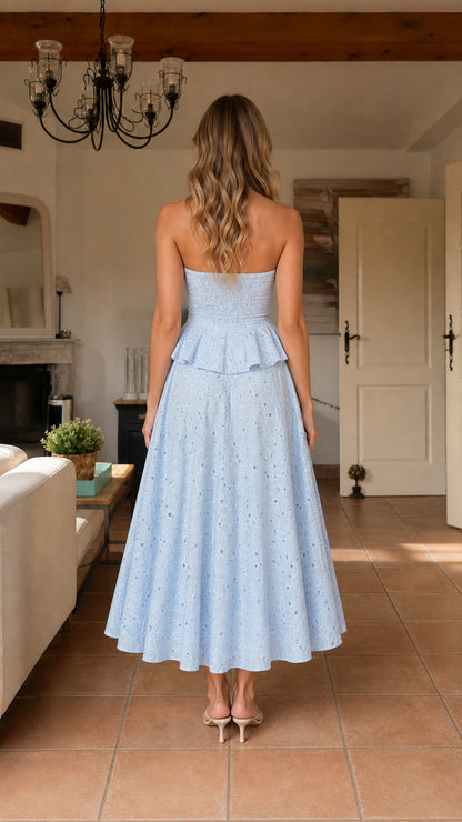 Back view of model wearing light blue eyelet midi dress