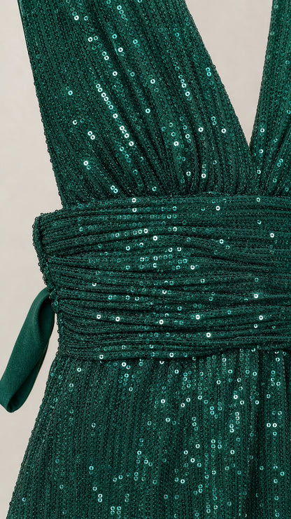Close-up detail of the sequin texture and pleated waist sash