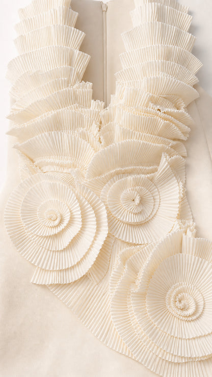 Close-up of pleated ruffle and rosette details