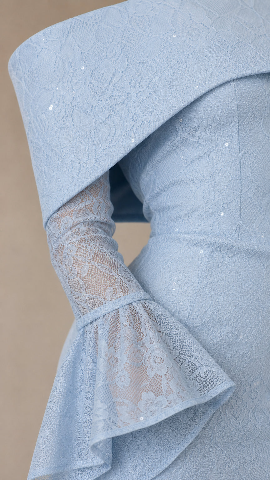 Close-up of folded neckline and bell sleeve texture