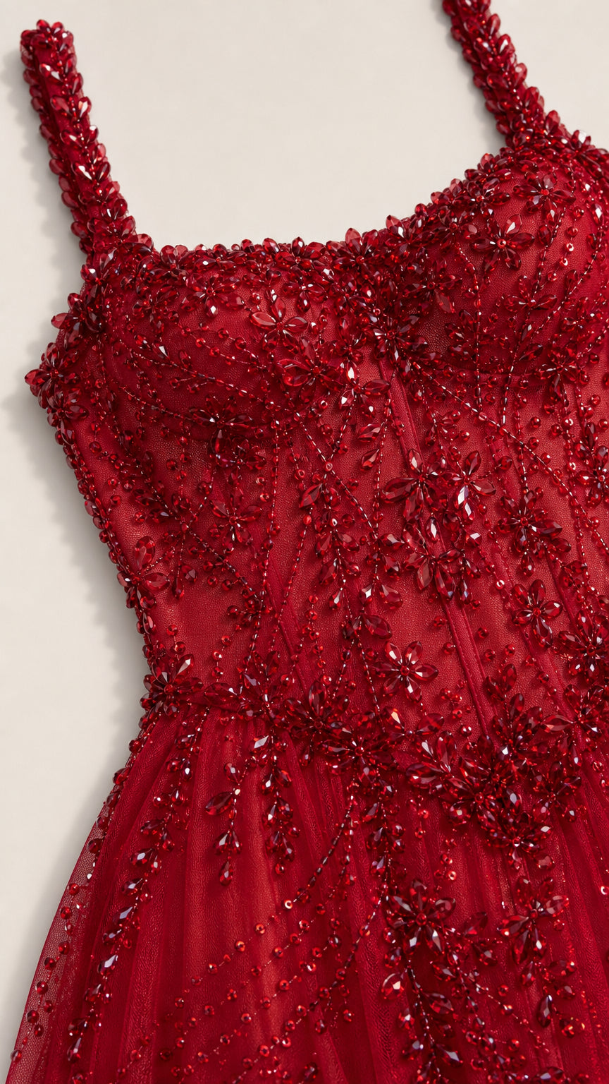 Close-up of bodice beadwork on red gown
