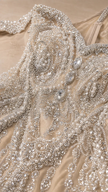 Close-up detail of intricate beadwork and crystal embellishments