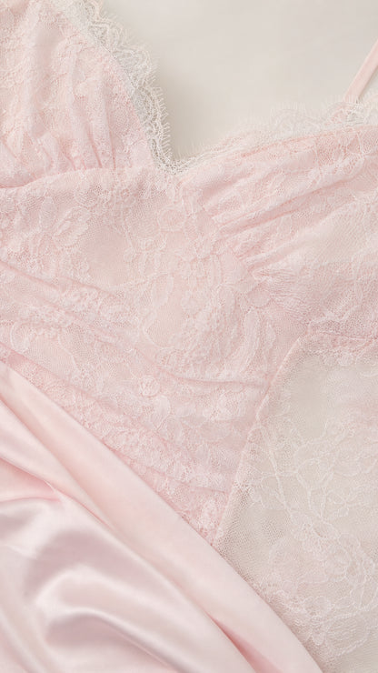Close-up detail of sheer lace bodice and smooth fabric