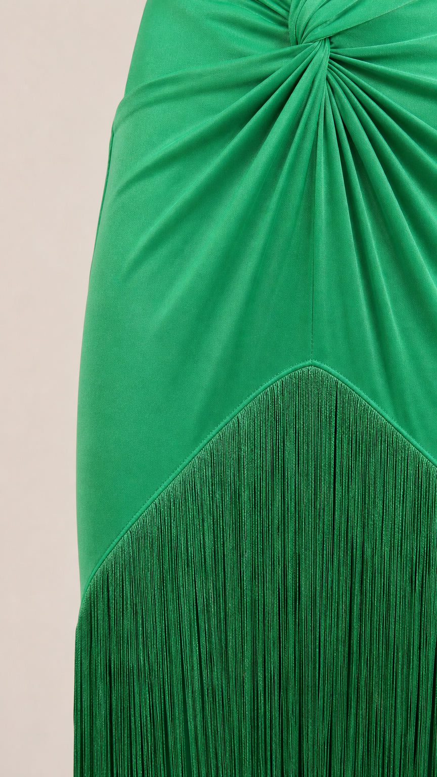 Close-up detail of knotted waist and fringe hemline