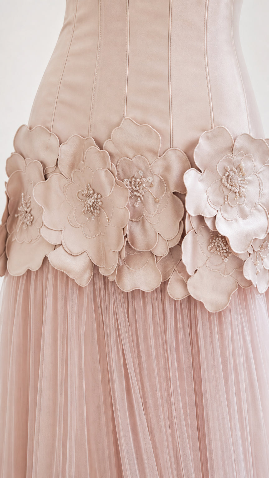 Close-up detail of 3D fabric flowers and beading on the dress waist