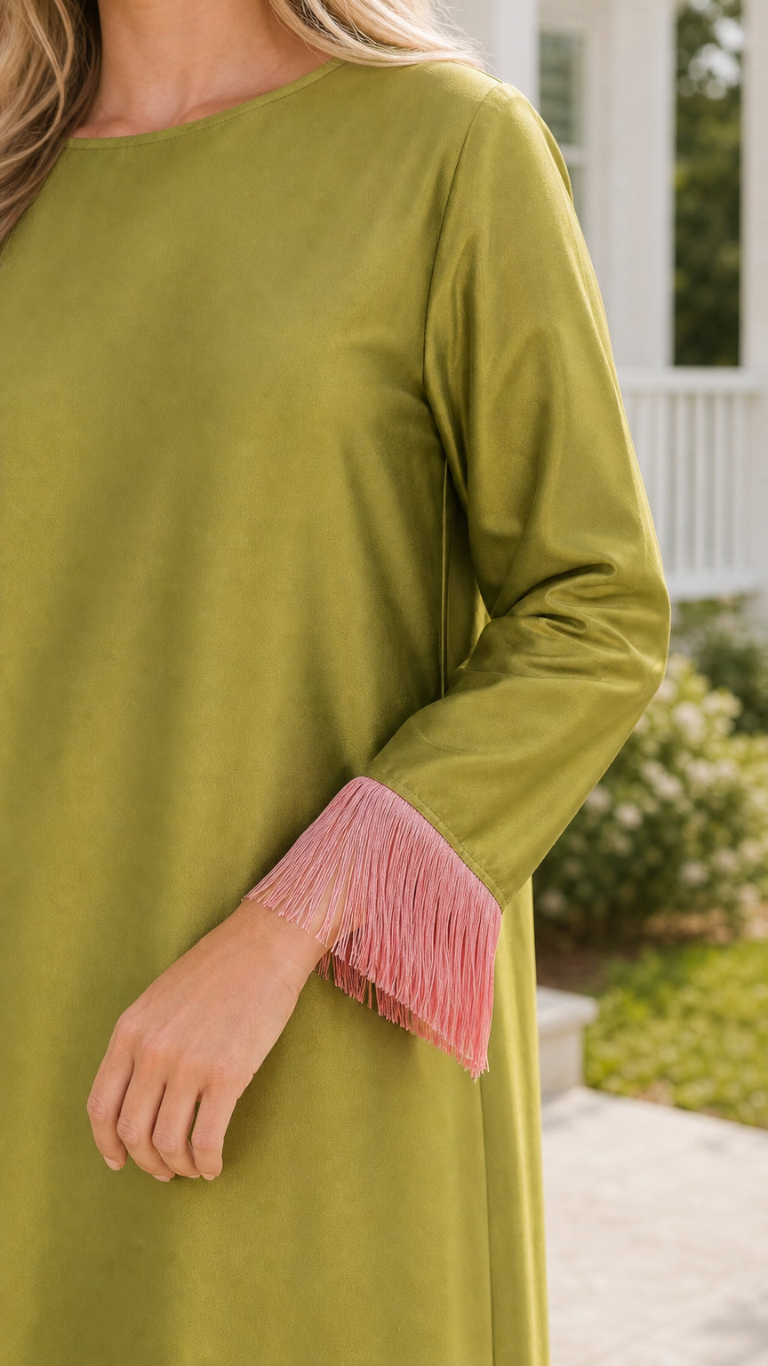Close-up of sleeve cuff with pink fringe detail