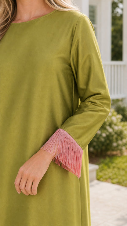 Close-up of sleeve cuff with pink fringe detail