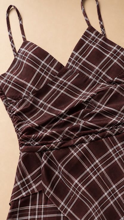 Close-up detail of the ruched bodice and plaid pattern on brown dress