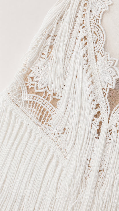 Close-up detail of white lace and fringe texture