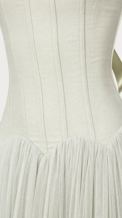 Close-up detail of structured vertical seams on the corset bodice