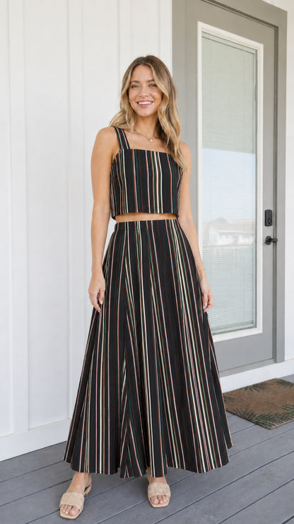 Woman wearing black striped two-piece set