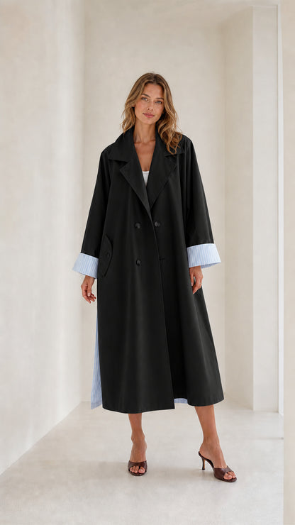 Front view of Black trench coat with striped cuffs
