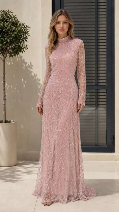 Full length view of model in blush pink beaded evening gown