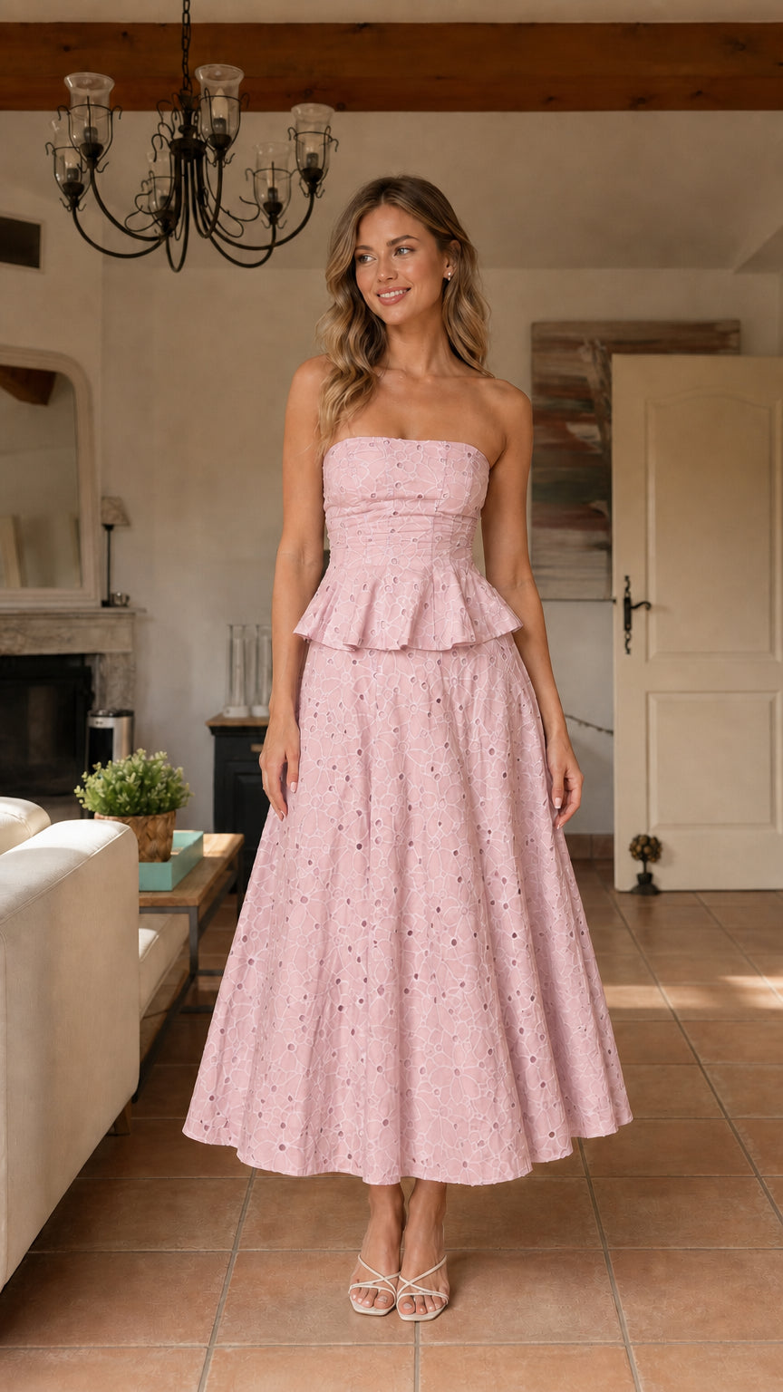Model wearing pink strapless eyelet midi dress