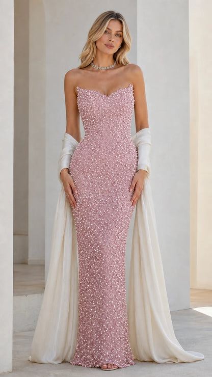 Front view of pink beaded strapless evening dress with draped wrap