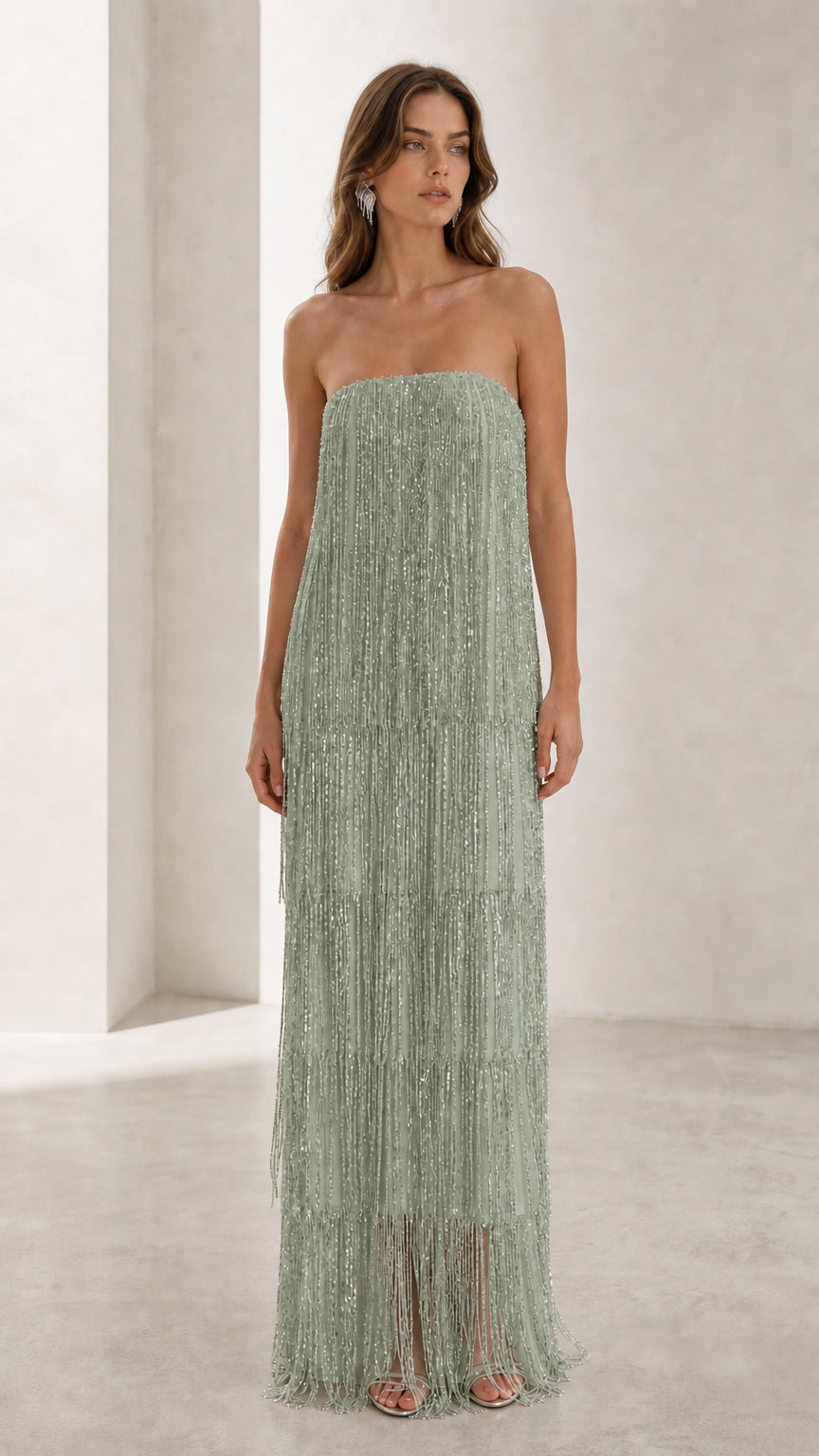 Full view of woman in sage green strapless beaded fringe maxi dress