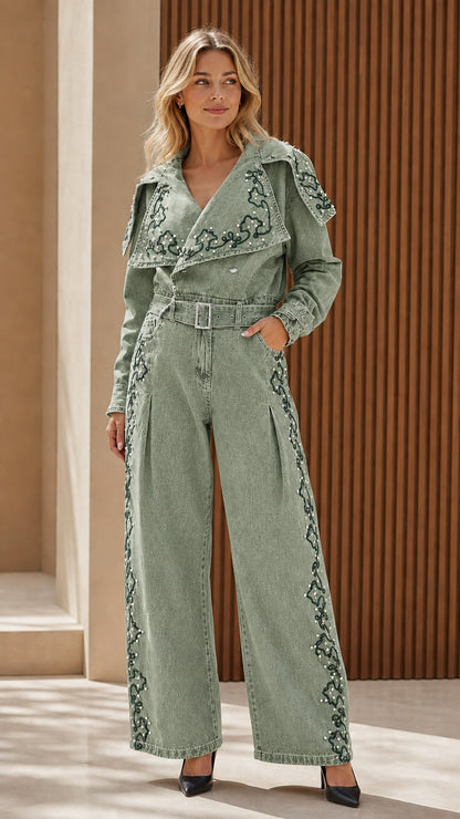 Model wearing sage green embroidered denim jumpsuit