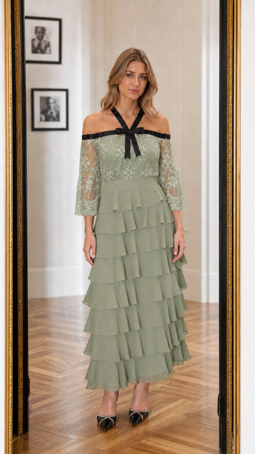 Front view of model wearing sage color variant