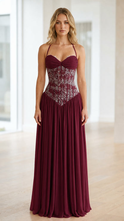 Front view of burgundy halter neck sequin corset long dress
