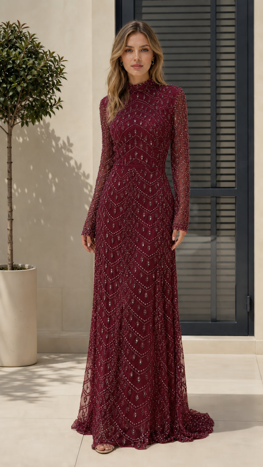 Full length view of model in burgundy formal evening gown