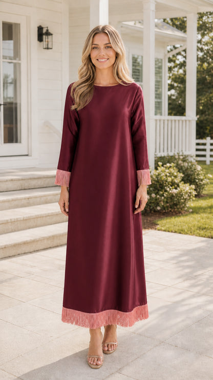 Front view of burgundy maxi dress with fringe trim
