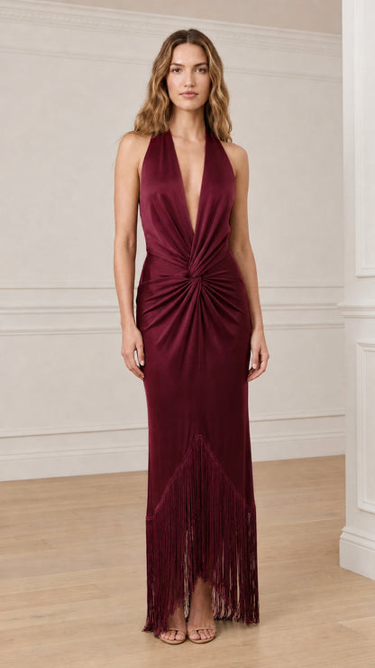 Model wearing burgundy satin halter fringe maxi dress