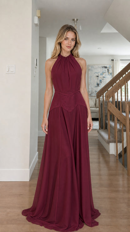 Model wearing burgundy color variant of the halter maxi dress