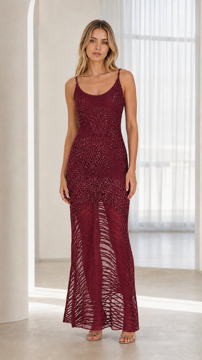 Model wearing burgundy sequin maxi dress
